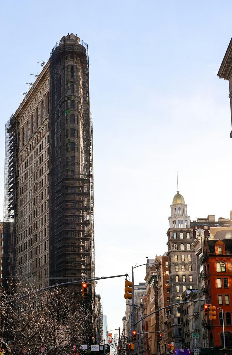 An amusing cartoon of someone trying to find their phone while holding a coffee and juggling keys, emphasizing everyday chaos.