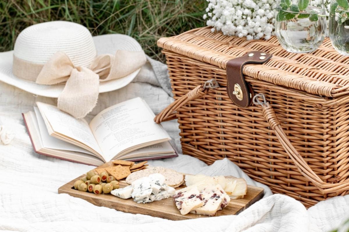 A vivid scene of friends sharing a laugh over a humorous mishap like a collapsed picnic setup in the park, emphasizing camaraderie and humor.